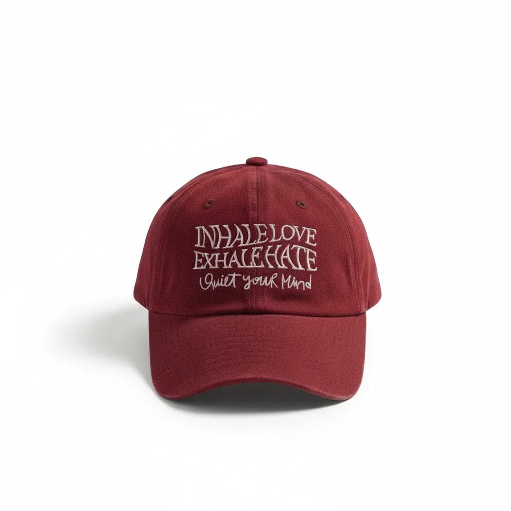 Maroon dad hat with embroidered 'Inhale Love Exhale Hate Quiet Your Mind' slogan, casual streetwear style