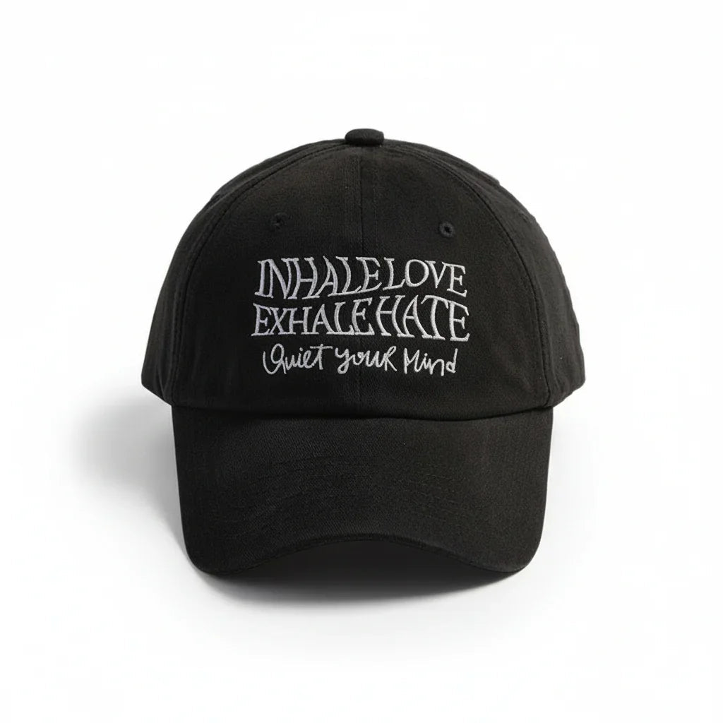 Black dad hat with embroidered 'Inhale Love Exhale Hate Quiet Your Mind' text, stylish streetwear cap